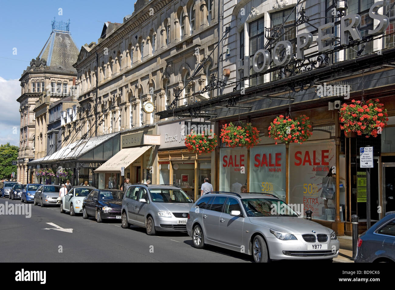Row of shops stores in the town centre in summer James Street Harrogate North Yorkshire England UK United Kingdom GB Great Britain Stock Photo