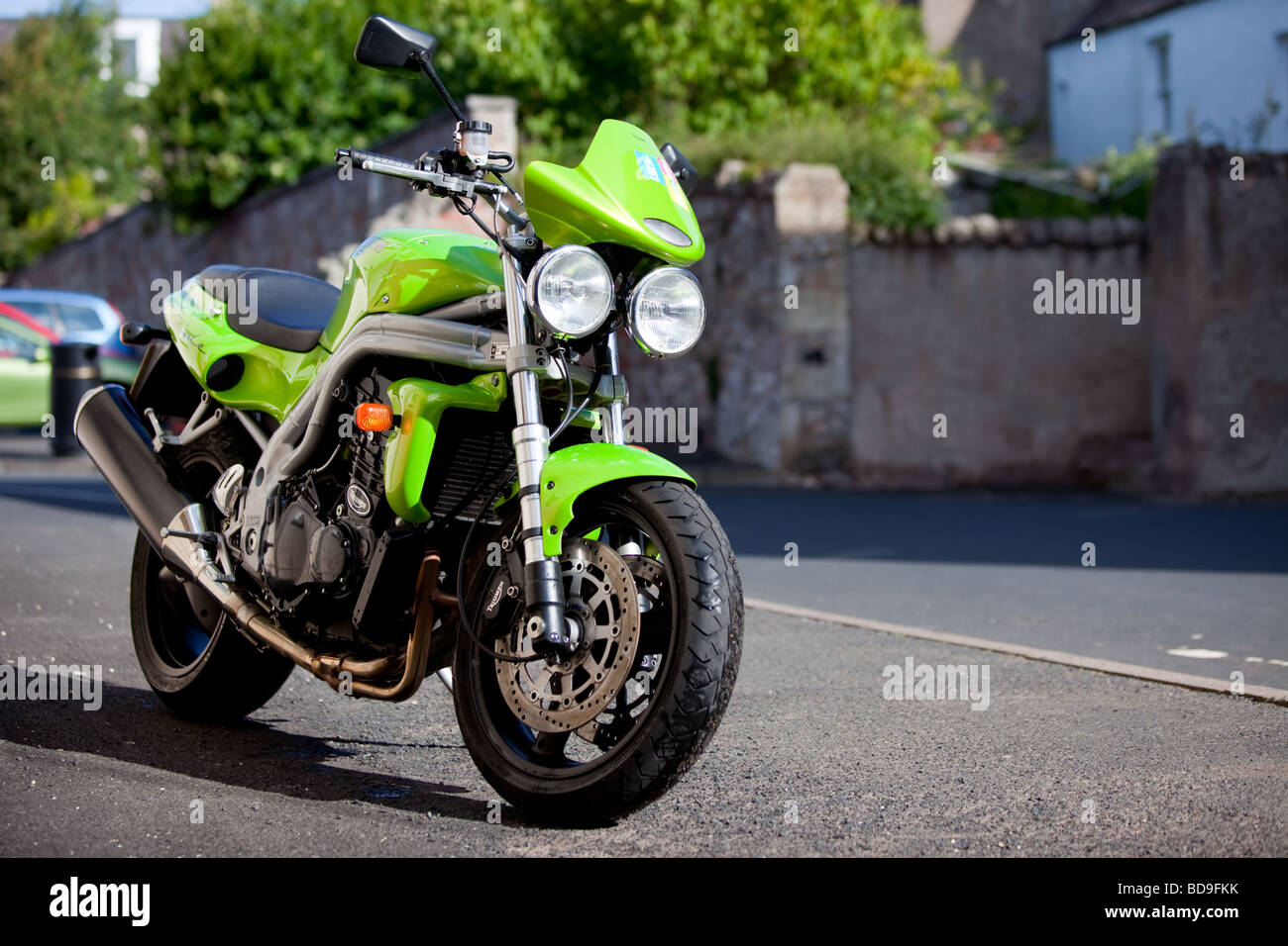 A bright green Triumph Speed Triple motorcycle Stock Photo Alamy