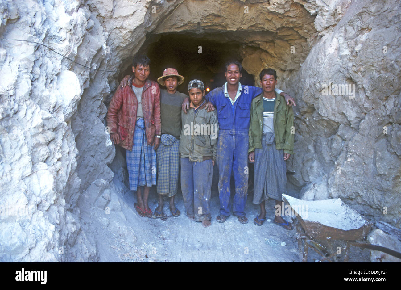Young Burmese boys work as miners at the world famous Mogok Ruby mines where some of the world's finest rubies are mined Stock Photo