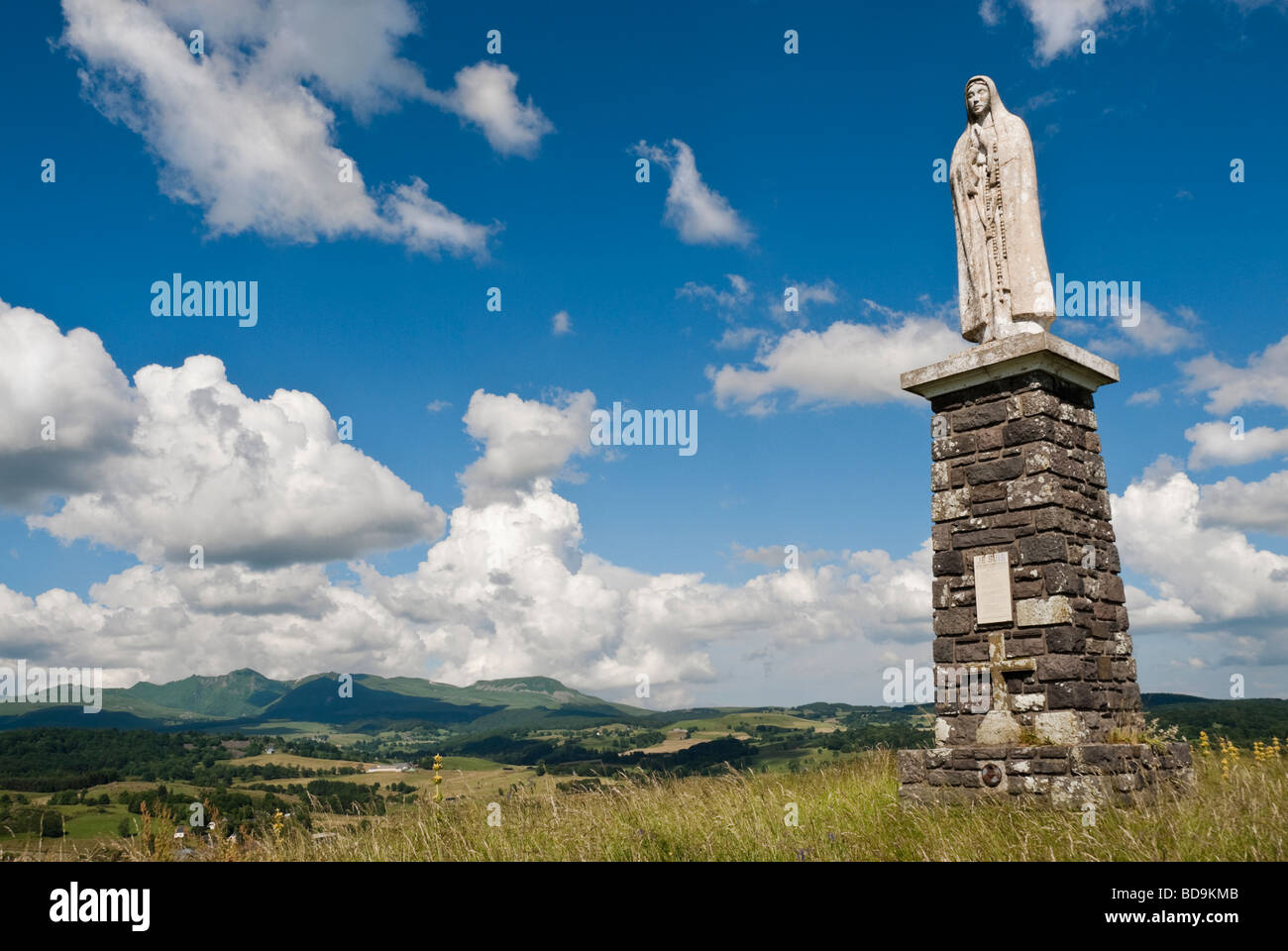Statue of La Vierge de Fatima St Donat Auvergne with view of the Massif de Sancy Auvergne France Stock Photo