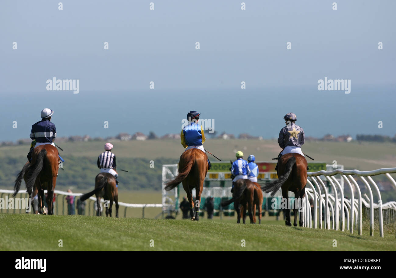 Jockey s and Horses make their way to the start before a Horse Race. Stock Photo