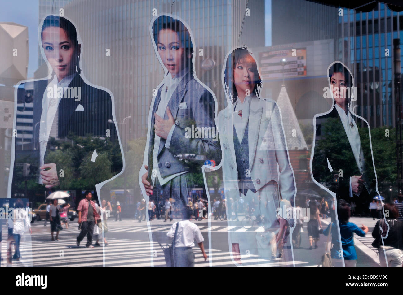 Pedestrians are reflected in a shop window in Ginza district Central Tokyo japan Stock Photo