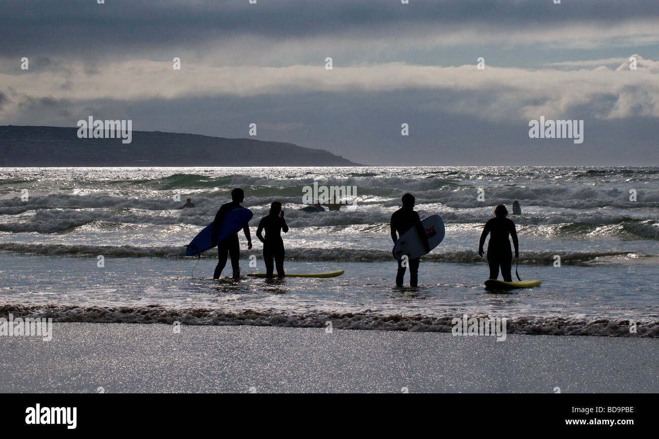 Surfers in the sea at Gwithian Towans in Cornwall. Photo by Gordon ...