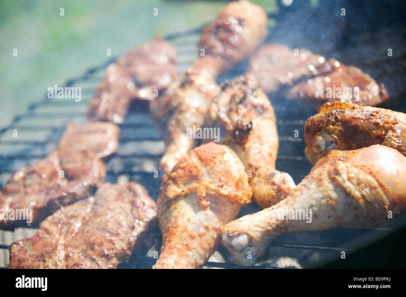 Barbecue chicken and steak drumsticks Stock Photo