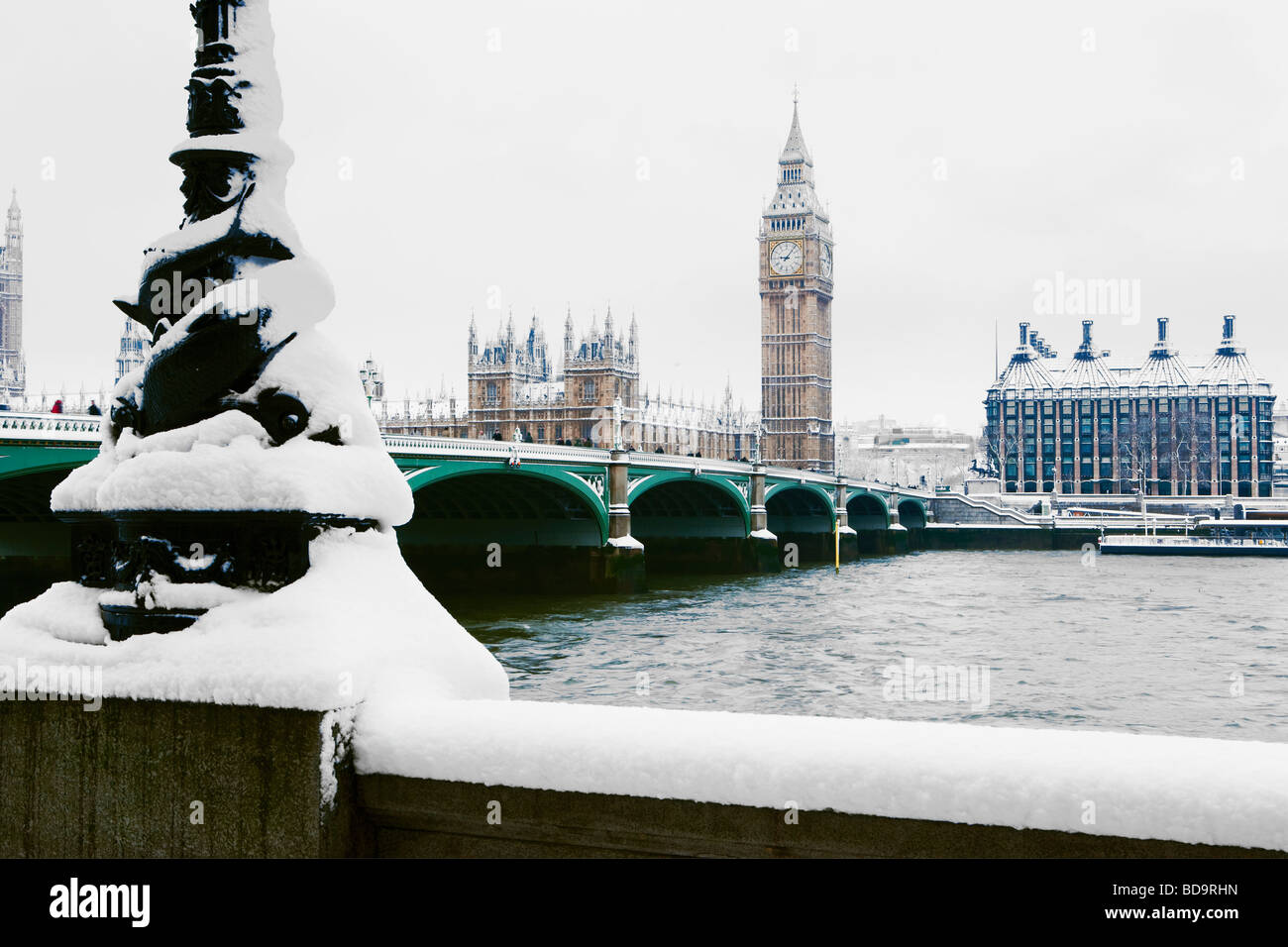 Snow on the South Bank Westminster Bridge Houses of Parliament and Big Ben London England Stock Photo