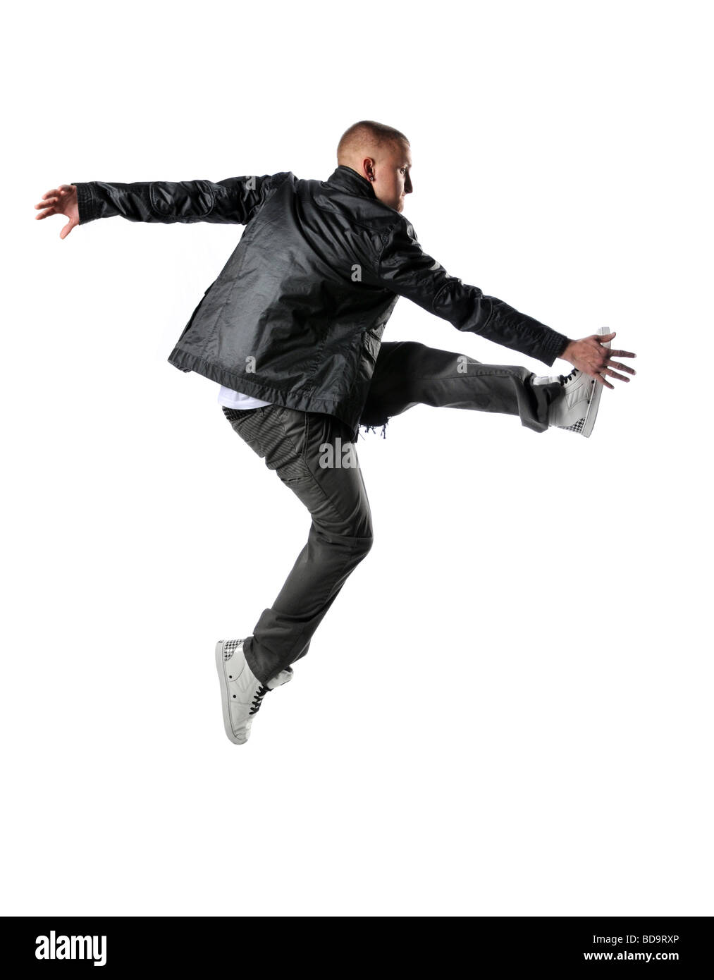 Hip hop style dancer performing jump Stock Photo