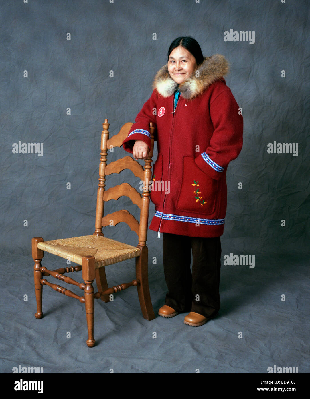 Color studio portrait of an Inuit woman wearing a traditional parka in ...
