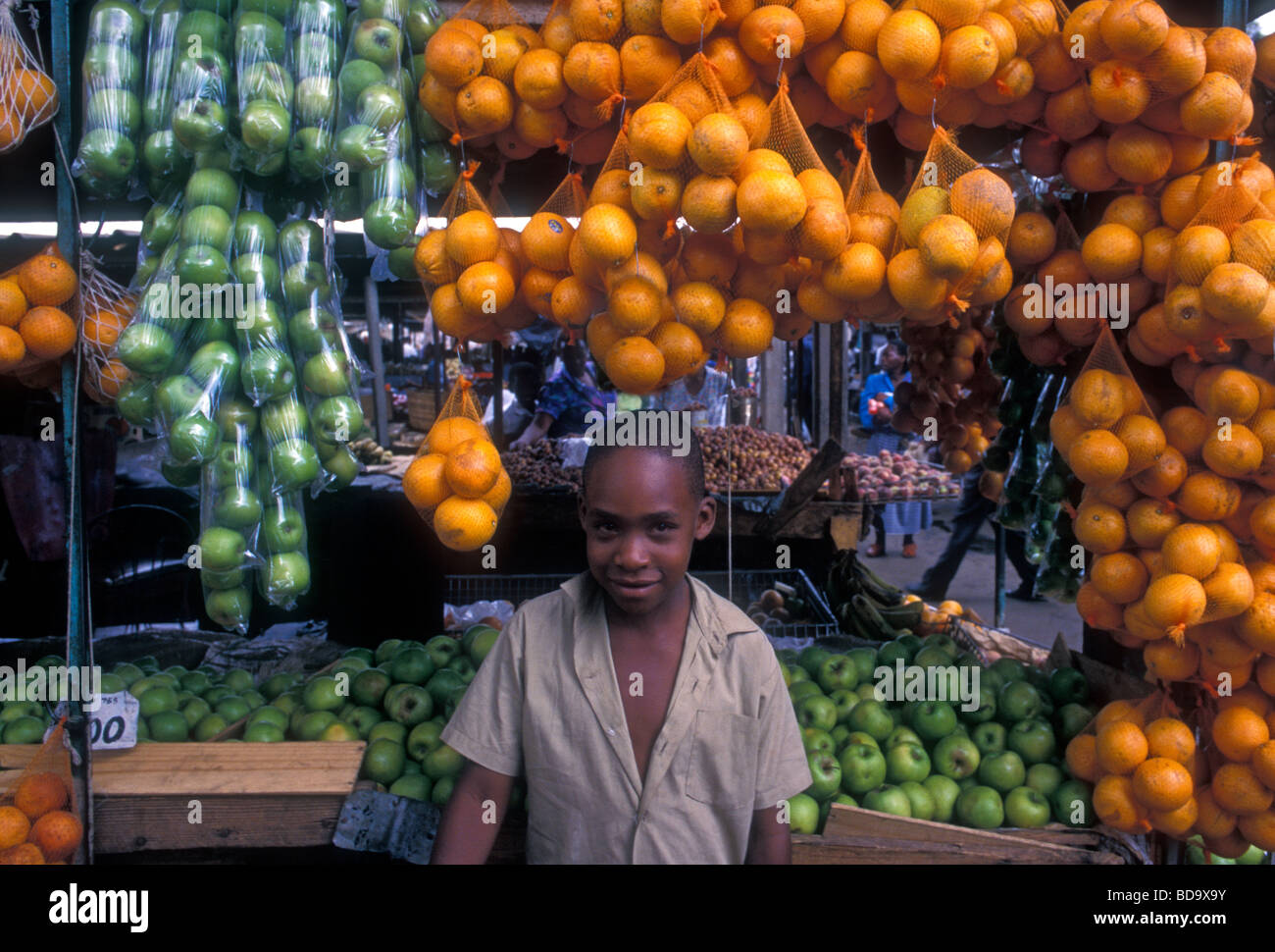 1, one, Zimbabwean boy, young boy, vendor, selling oranges, fruit and vegetable market, central market, city of Harare, Harare Province, Zimbabwe Stock Photo