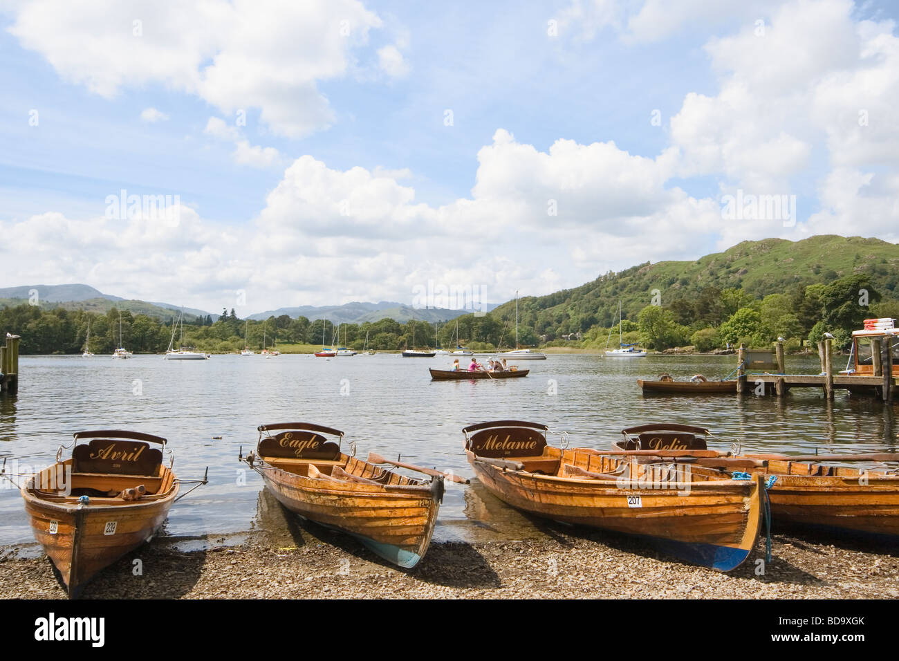Rowing boats for hire on the shore of Lake Windermere Cumbria England