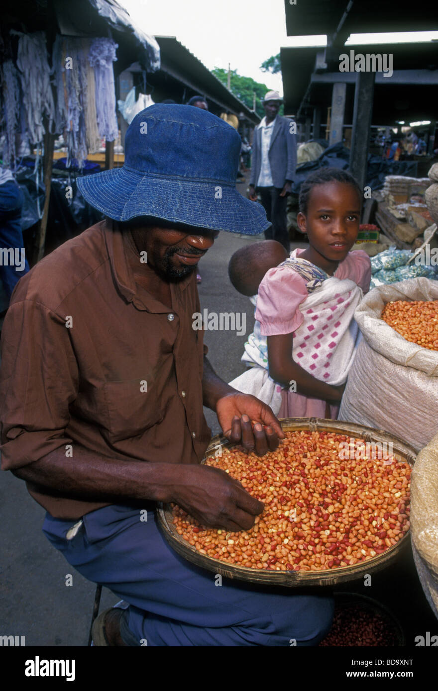 Zimbabwean man, vendor, seller, selling dried beans, legumes, central market, city of Harare, Harare Province, Zimbabwe Stock Photo