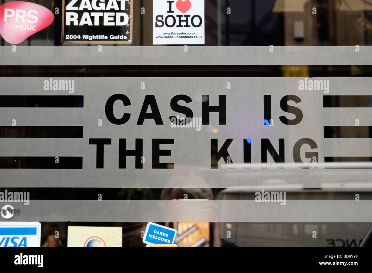 Cash is the King sign in restaurant window Stock Photo