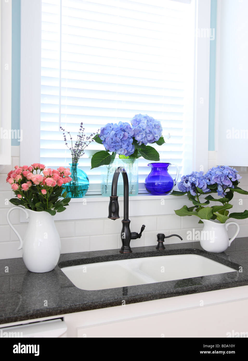 Kitchen sink with flowers Stock Photo