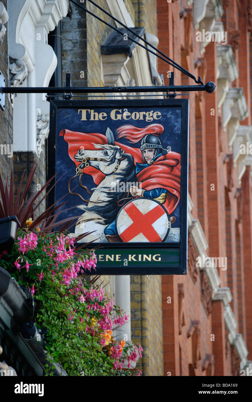 The George pub sign showing St George and dragon Great Portland Street London England Stock Photo