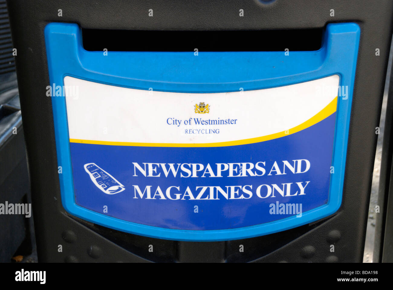 Newspaper and magazine recycling bin Stock Photo Alamy