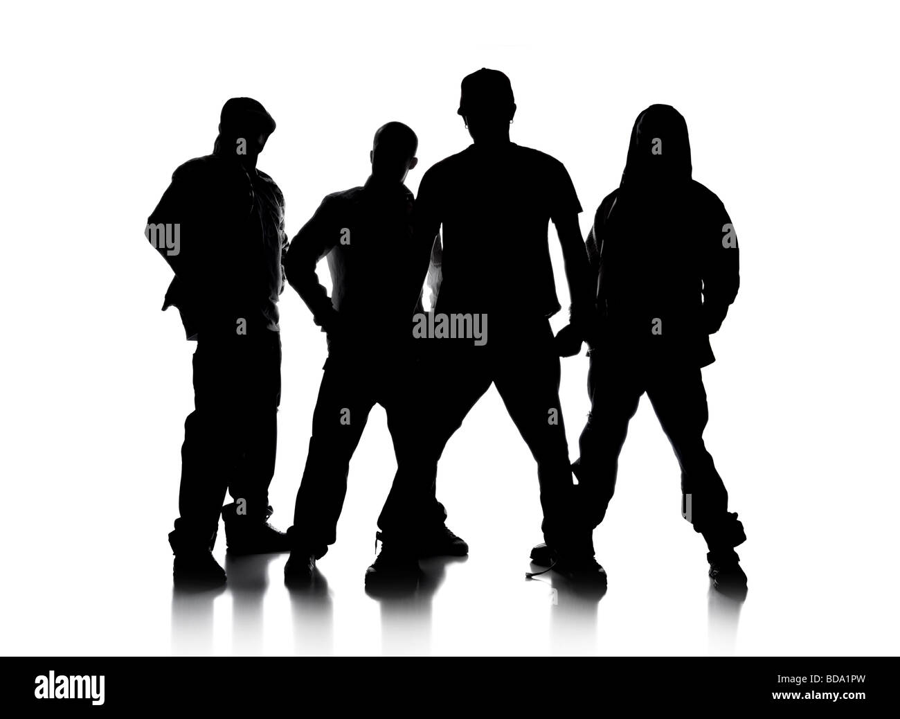 Silhouettes of men standing over a white background Stock Photo