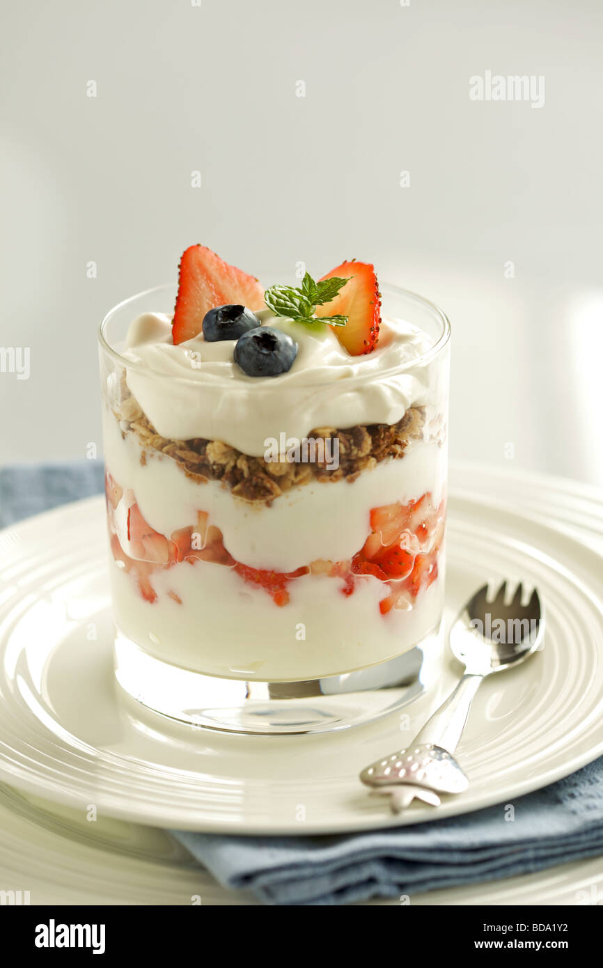 Strawberry yogurt parfait with granola in a glass Stock Photo