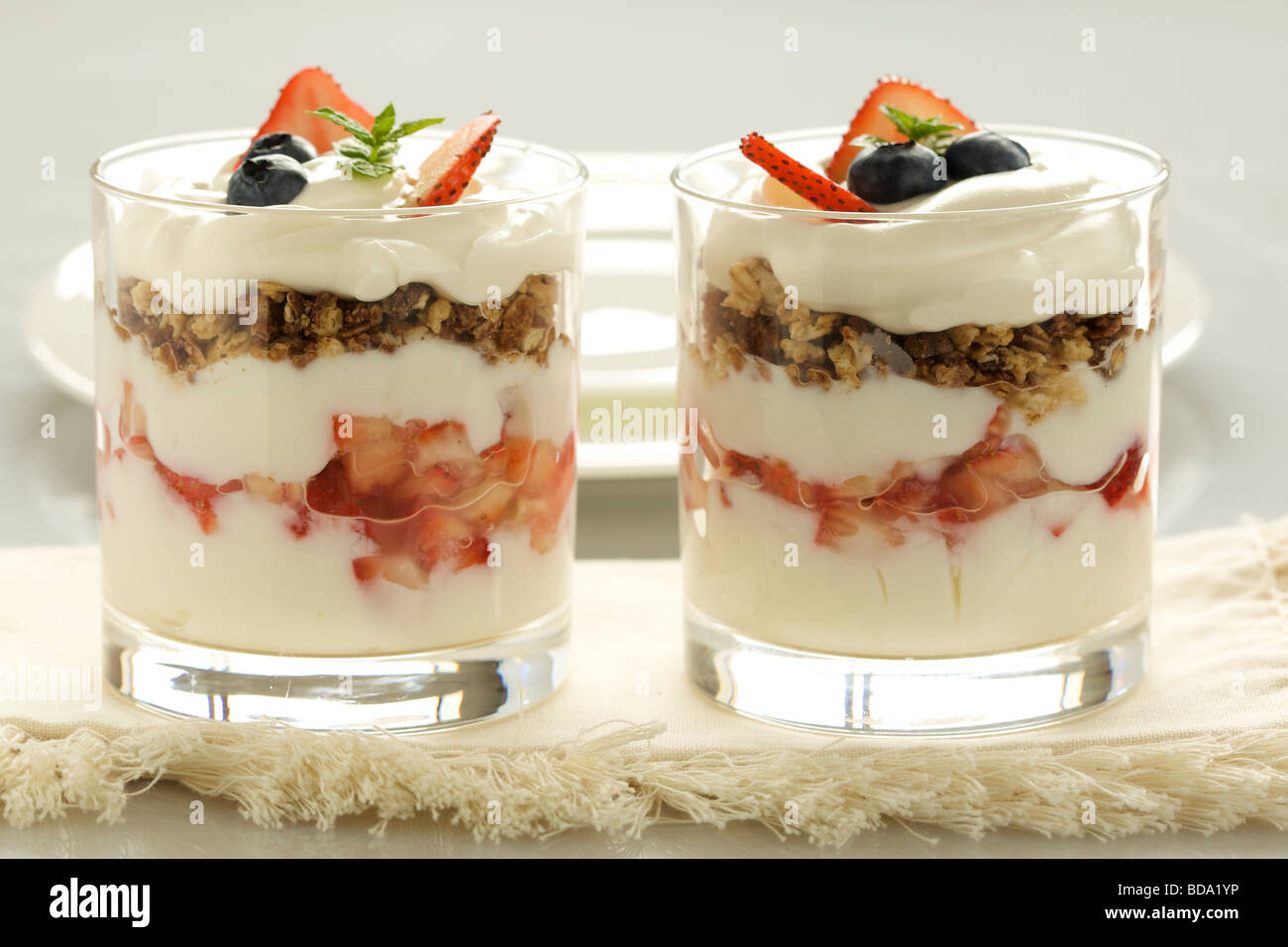 Strawberry yogurt parfait with granola in a glass Stock Photo