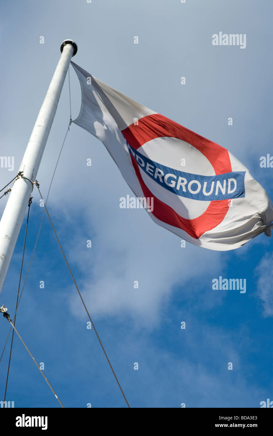 Transport for London underground flag fluttering on flagpole Stock Photo
