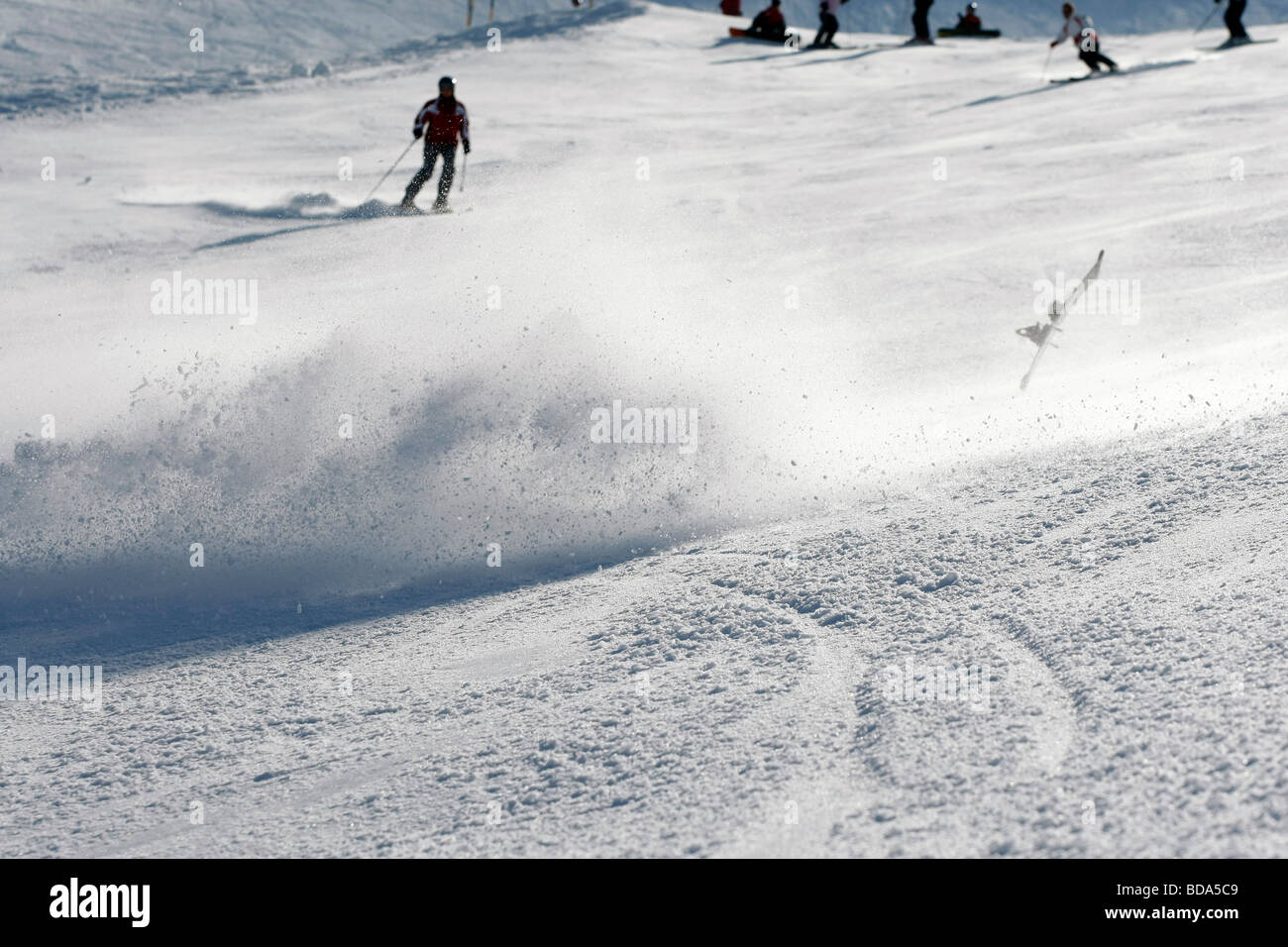 Skier falling down while going downhill in Austria Stock Photo - Alamy
