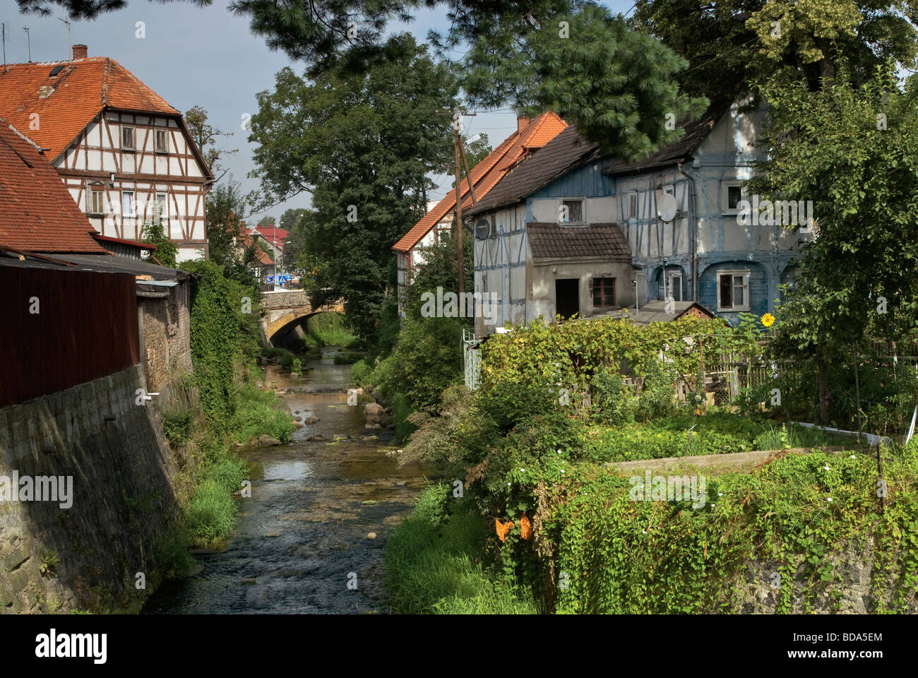 Half timbered Lusatian weavers houses over Miedzianka river in Bogatynia Lower Silesia region Poland Stock Photo