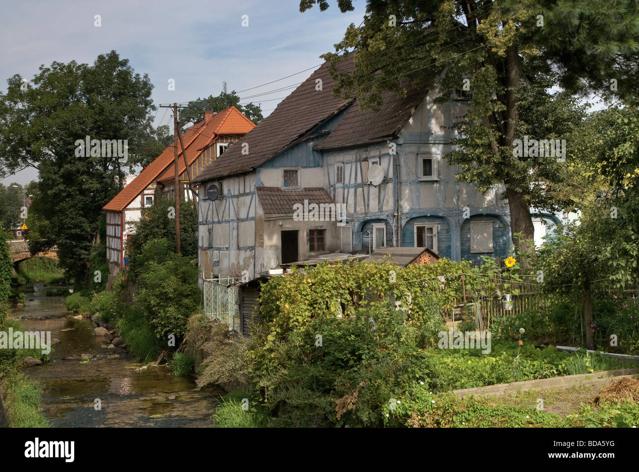 Half timbered Lusatian weavers houses over Miedzianka river in Bogatynia Lower Silesia region Poland Stock Photo