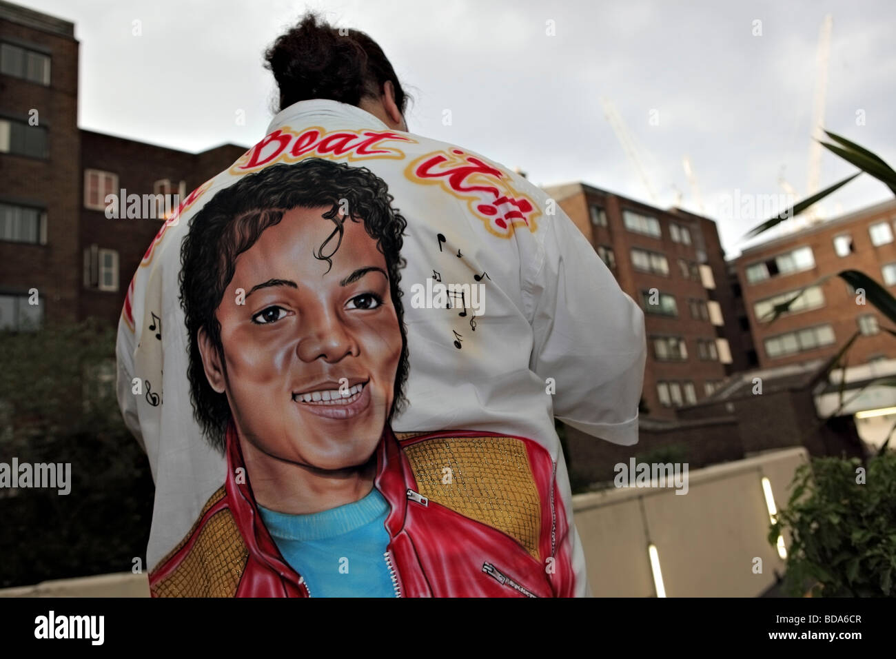 Michael Jackson's fan poses with customized shirt within a UK council estate. Stock Photo