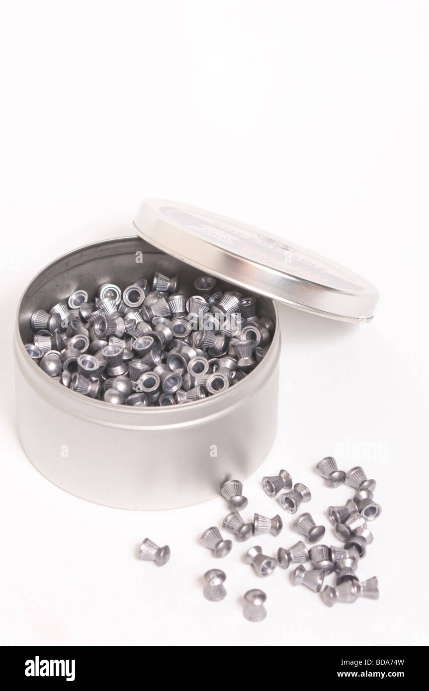 A close up of a tin of airgun pellets on a white background Stock Photo