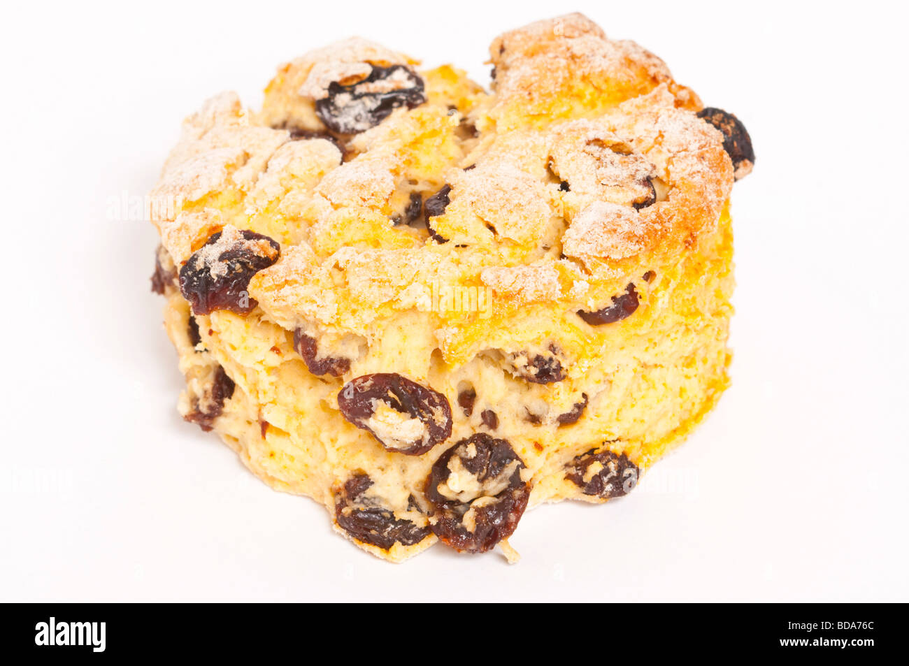 A close up of a homemade fruit scone on a white background Stock Photo