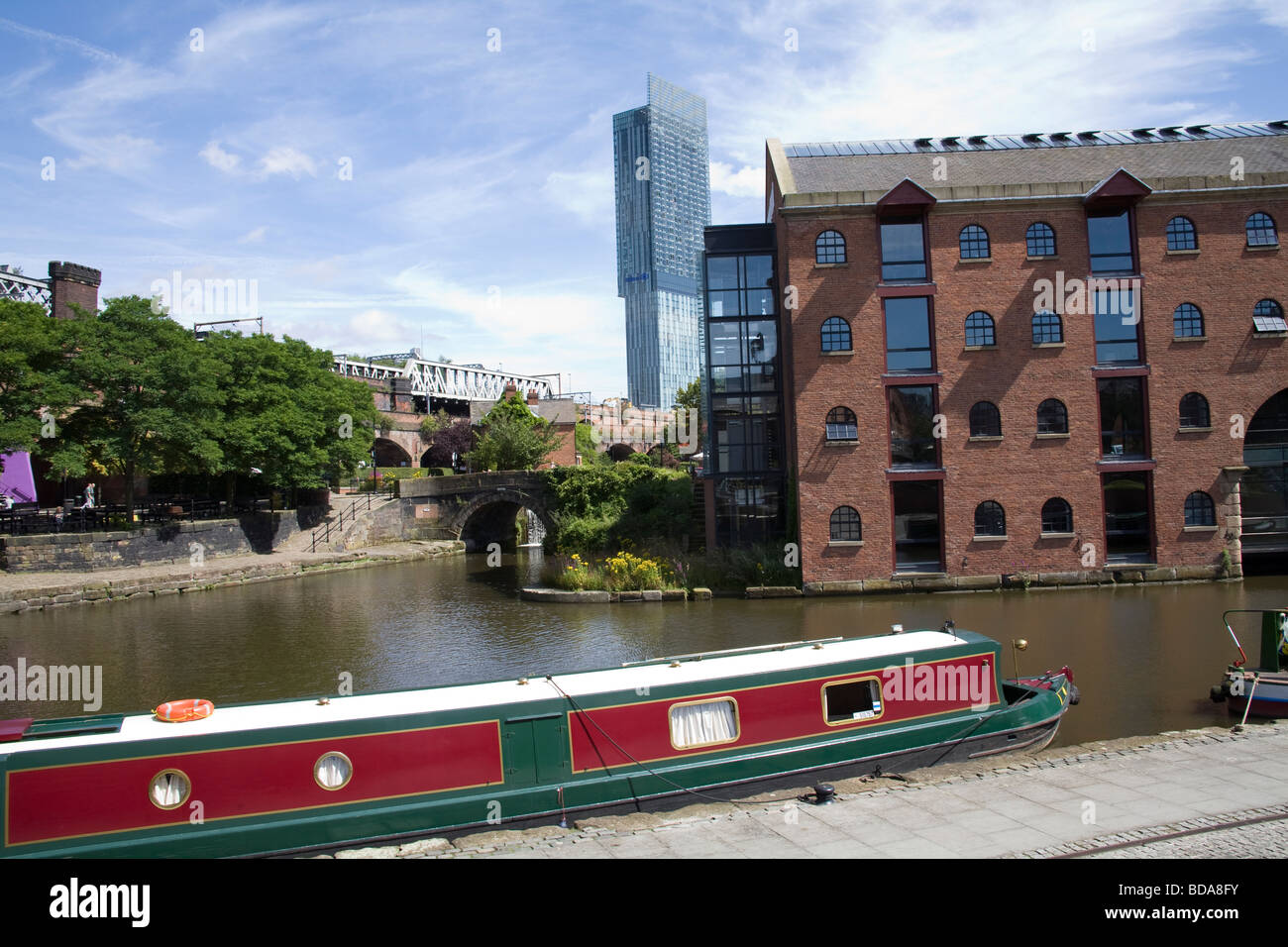 Manchester England UK Narrowboat moored on a canal in the redeveloped Castlefield Urban Heritage Park the world's first urban heritage park in 1982 Stock Photo