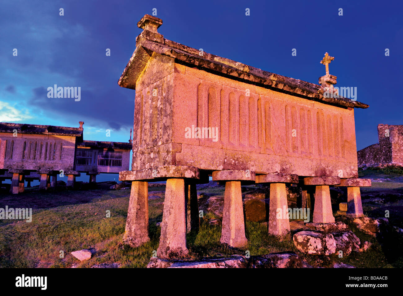 Portugal, Minho: Nocturnal view of traditional corn storehouses in Lindoso Stock Photo