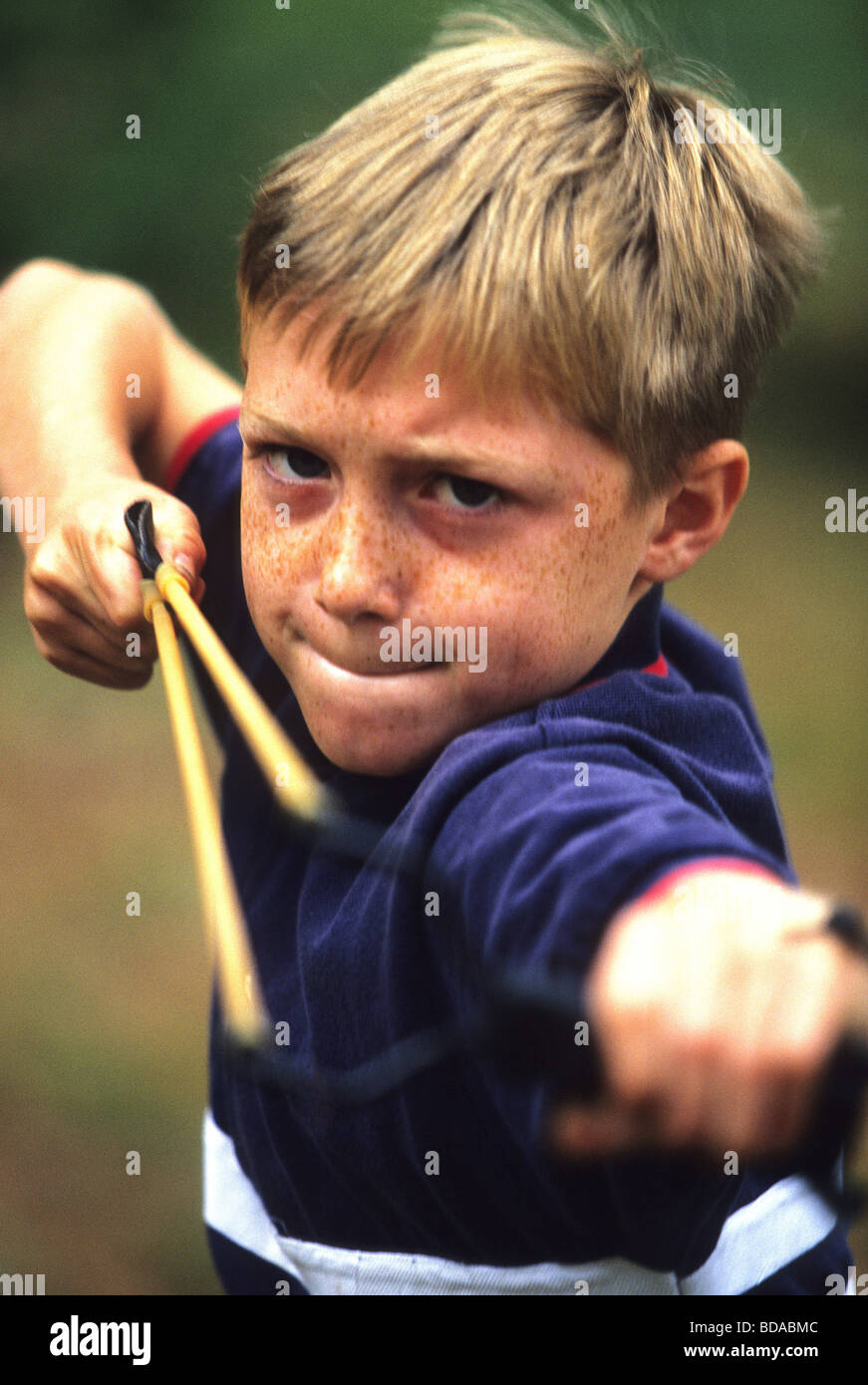 Boy with Sling Shot Stock Photo