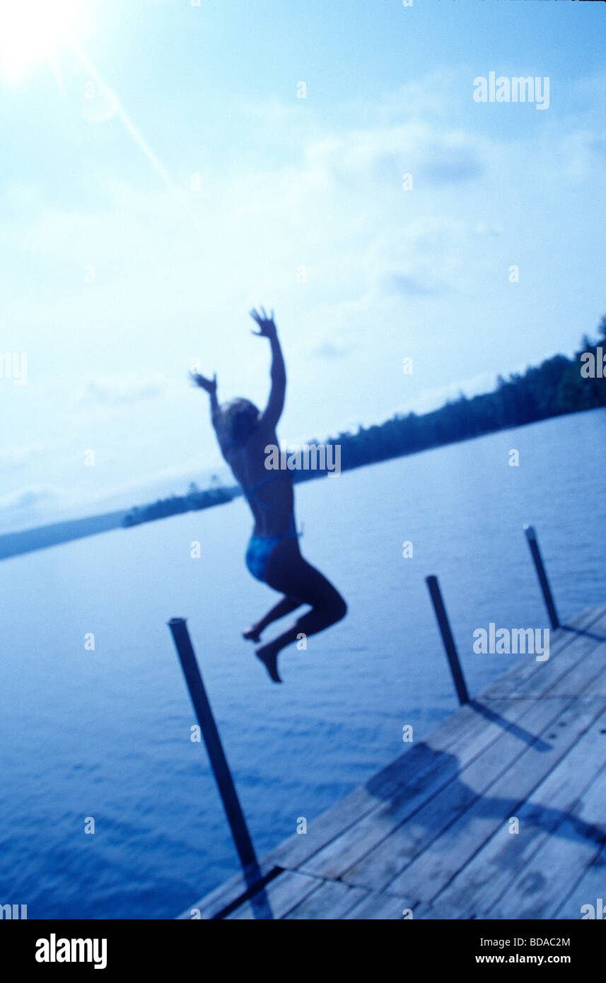 Teen Girl Jumping off Dock Sebago Lake, Maine Stock Photo Alamy