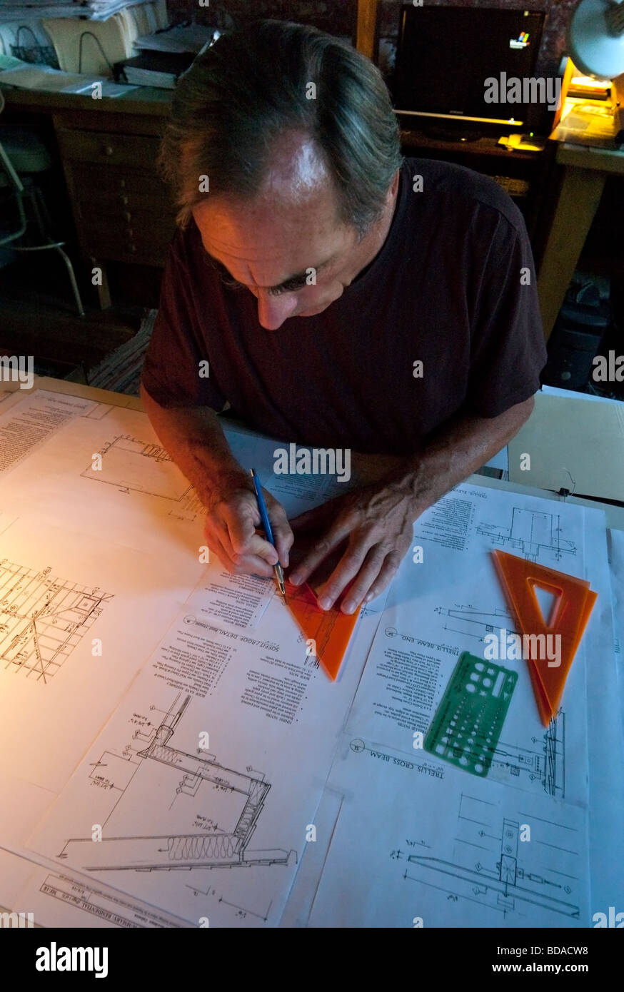 Architect at work at drafting table Stock Photo