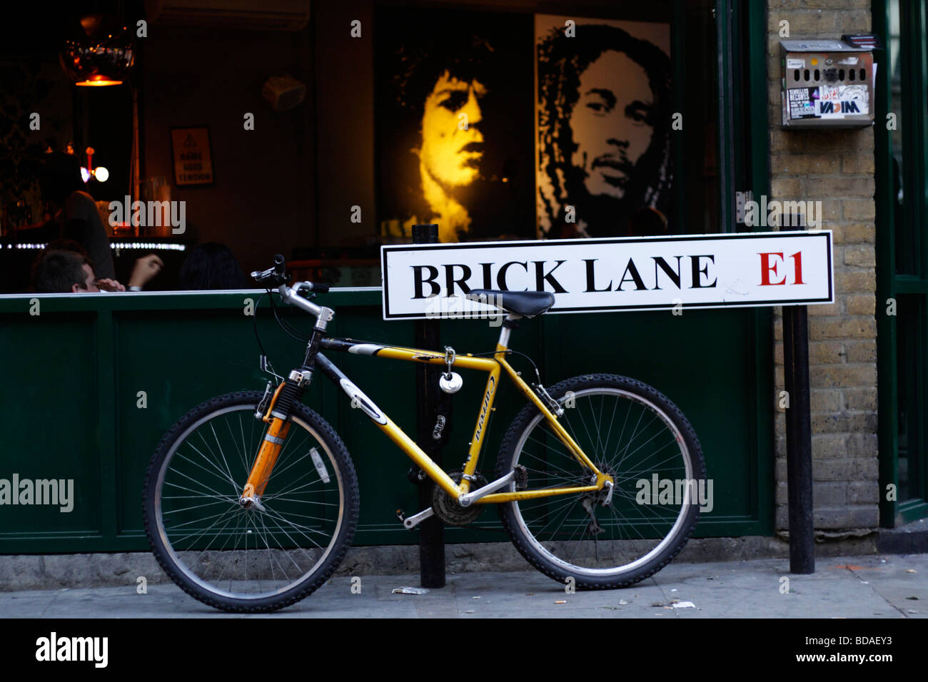 Brick lane street sign an a bicycle in Brick lane London Stock Photo