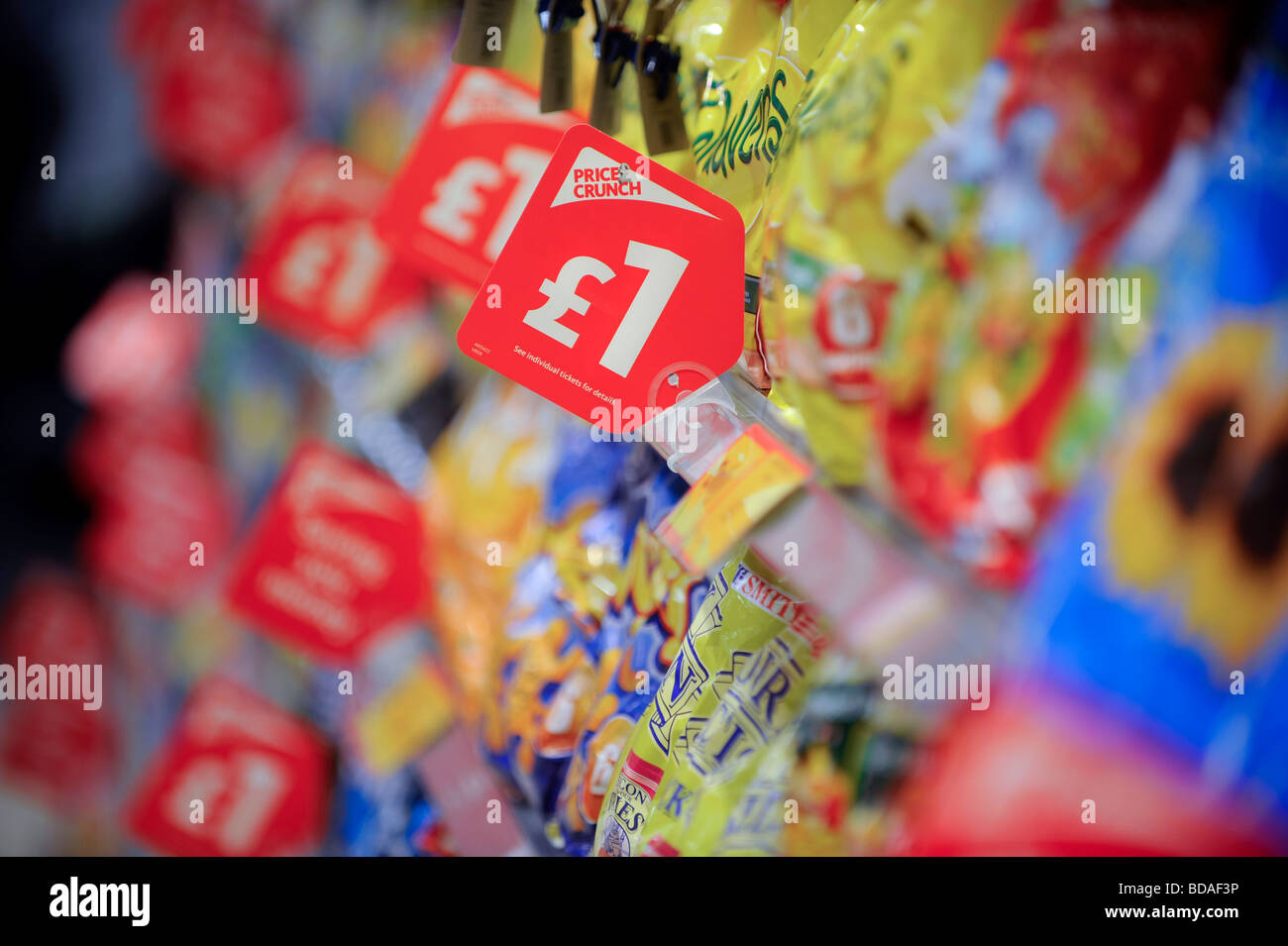 Supermarket shelves with price crunch price tags encouraging shoppers to spend. Stock Photo