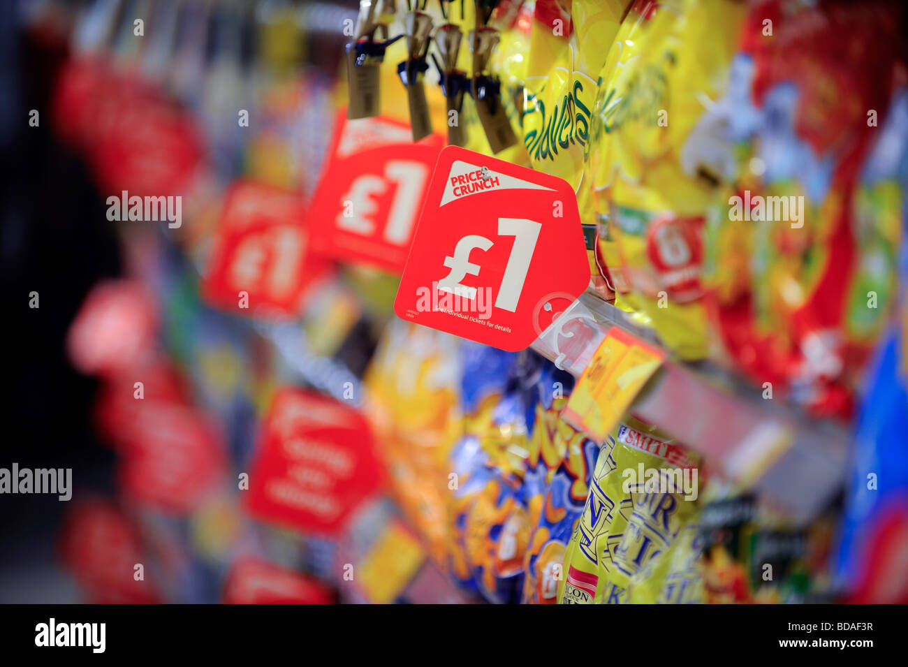 Supermarket shelves with price crunch price tags encouraging shoppers to spend. Stock Photo