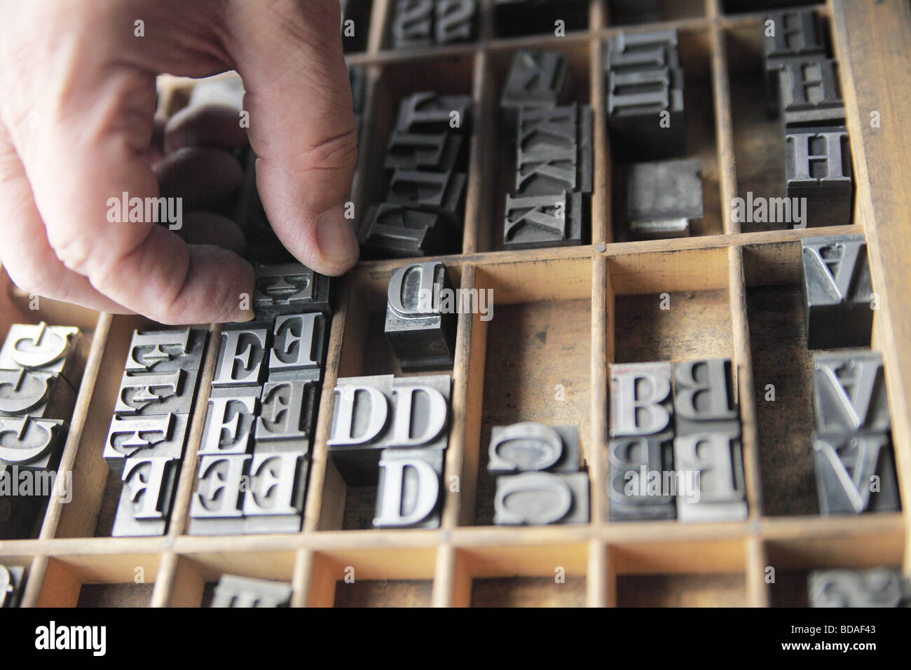 hand sorting letterpress lead type Stock Photo