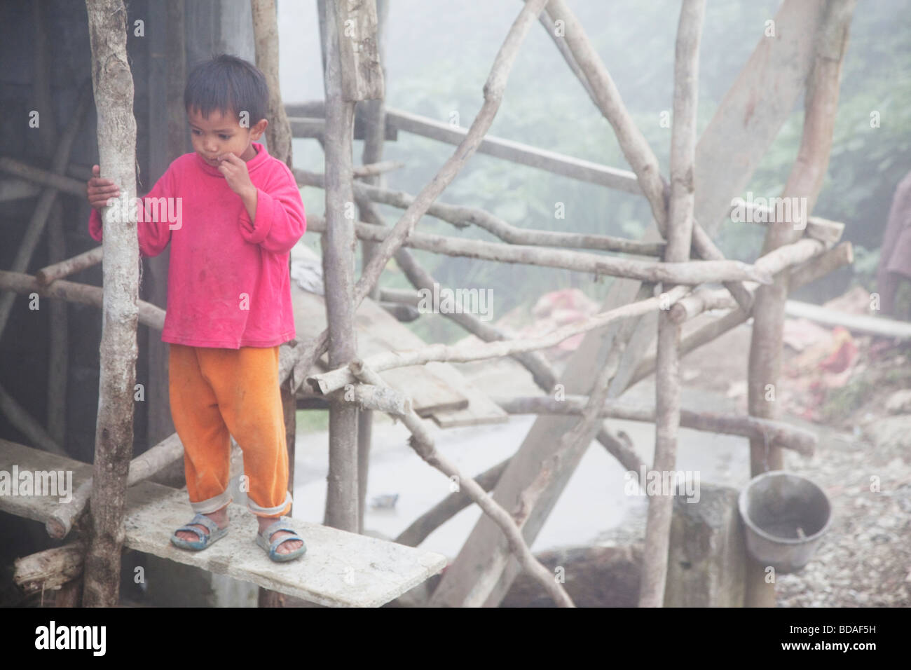 Young boy amongst scaffolding Banaue and Bontoc Northern Luzon Philippines Stock Photo
