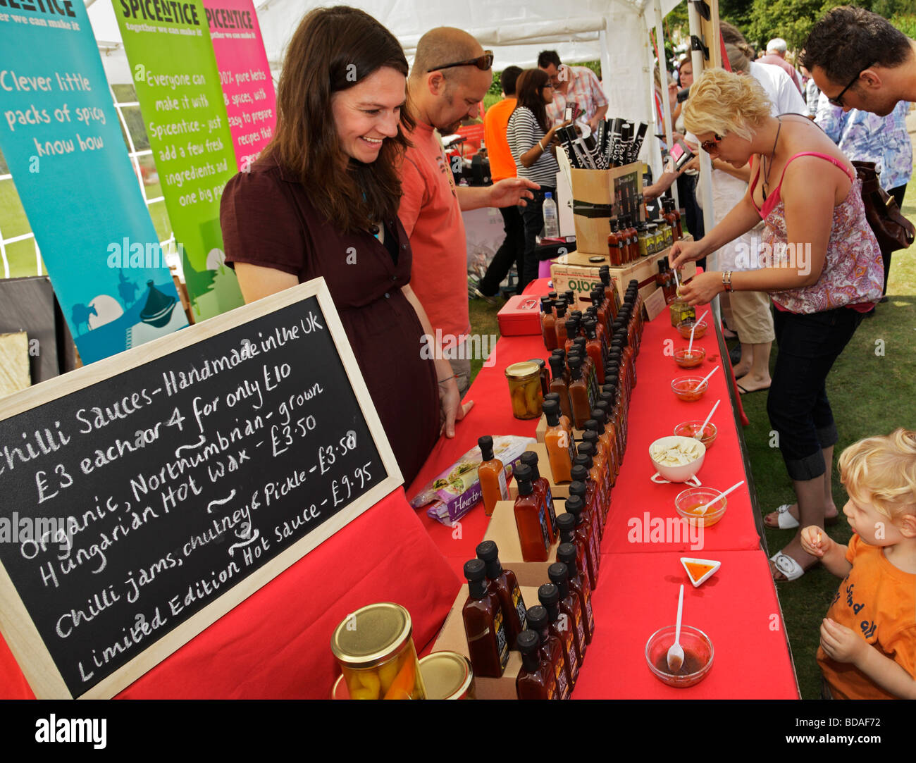 Little boy trying various chilli sauces West Dean Chilli Fiesta West Little boy trying various chilli sauces West Dean Chilli Fiesta West