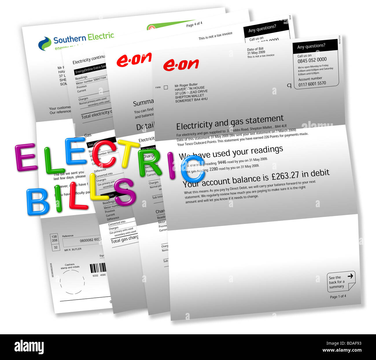 Electric bills on white with ‘ELECTRIC BILLS’ spelt out by magnetic fridge letters. Stock Photo