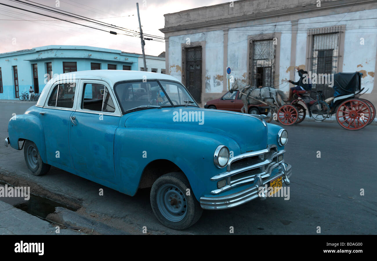 An american historic car in the streets of Cuba Cuba with its old houses seen on February 28 2009. Stock Photo