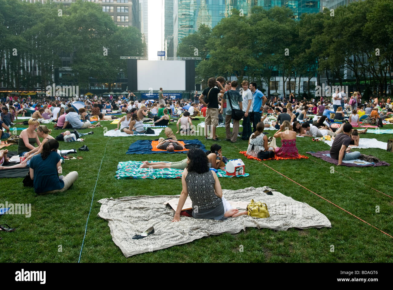 Thousands of people spread their blankets and claim their chairs in Bryant Park in New York on Monday free movie night Stock Photo