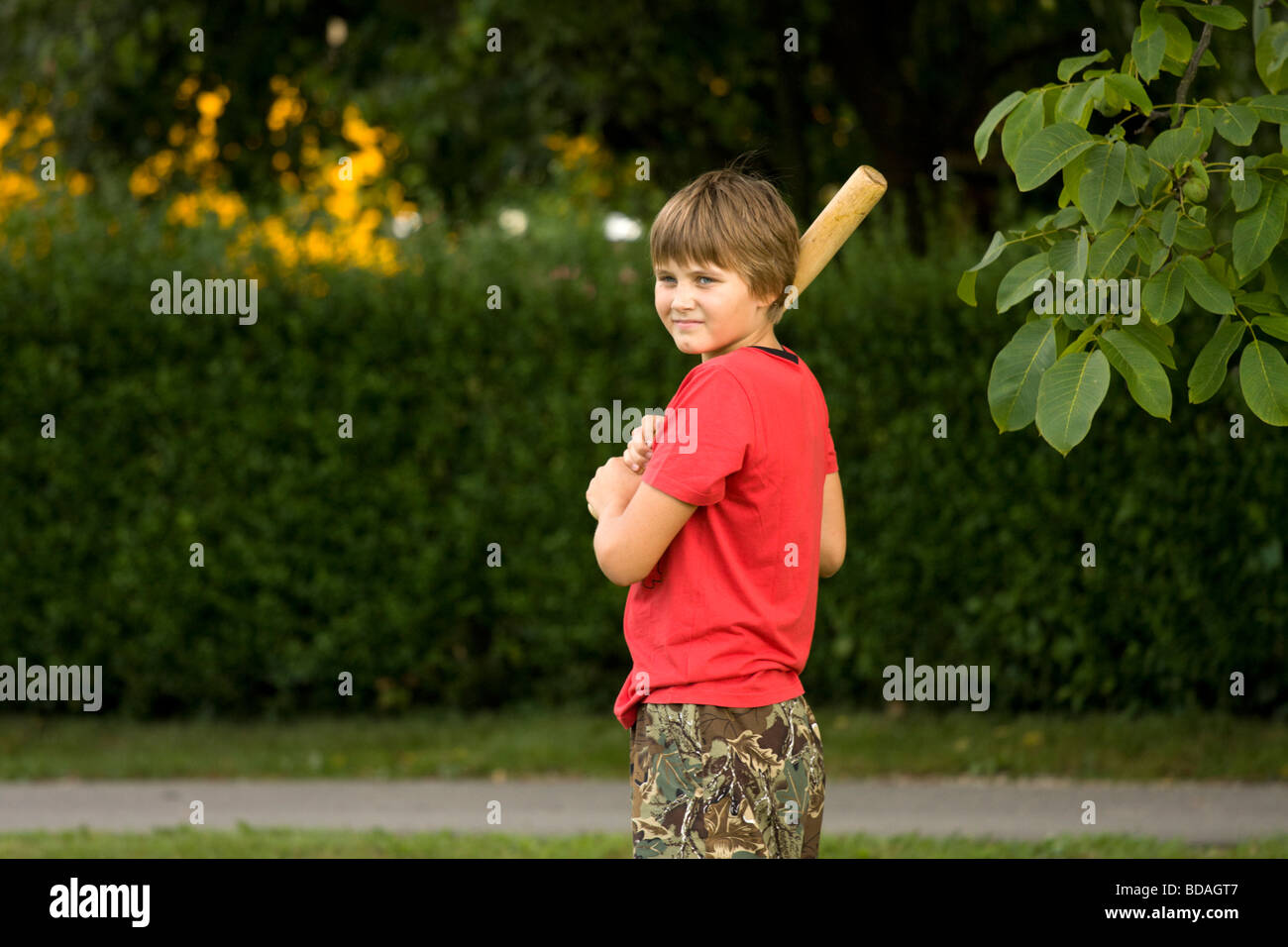 Boy preparing to hit the ball with the baseball bat Stock Photo