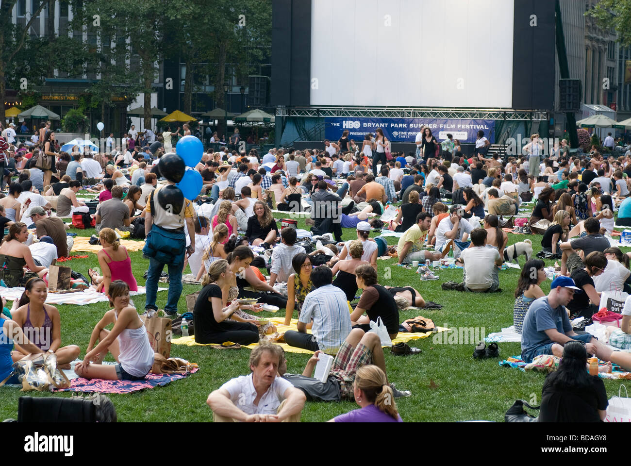 Thousands of people spread their blankets and claim their chairs in Bryant Park in New York on Monday free movie night Stock Photo