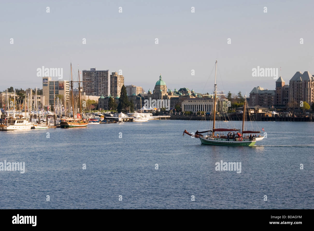 Traditional style two mast sailing ship pulls into the inner harbour