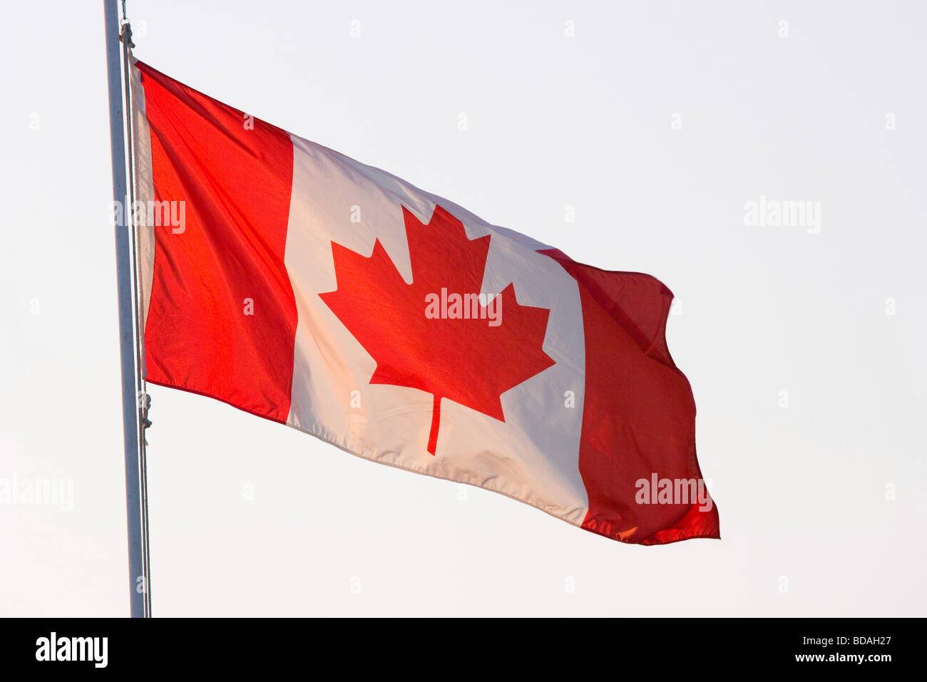 Backlit Canadian Flag flying on Canada Day, July 1 Stock Photo