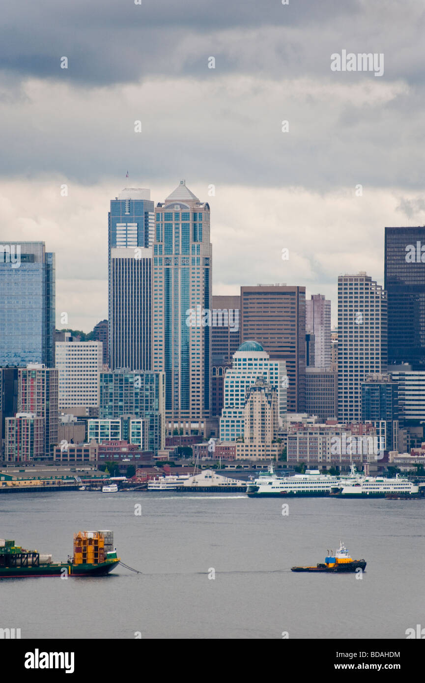 The Seattle skyline as seen from West Seattle. Ships and boats ply the waters of Elliott Bay. Seattle is also a cruise ship port Stock Photo