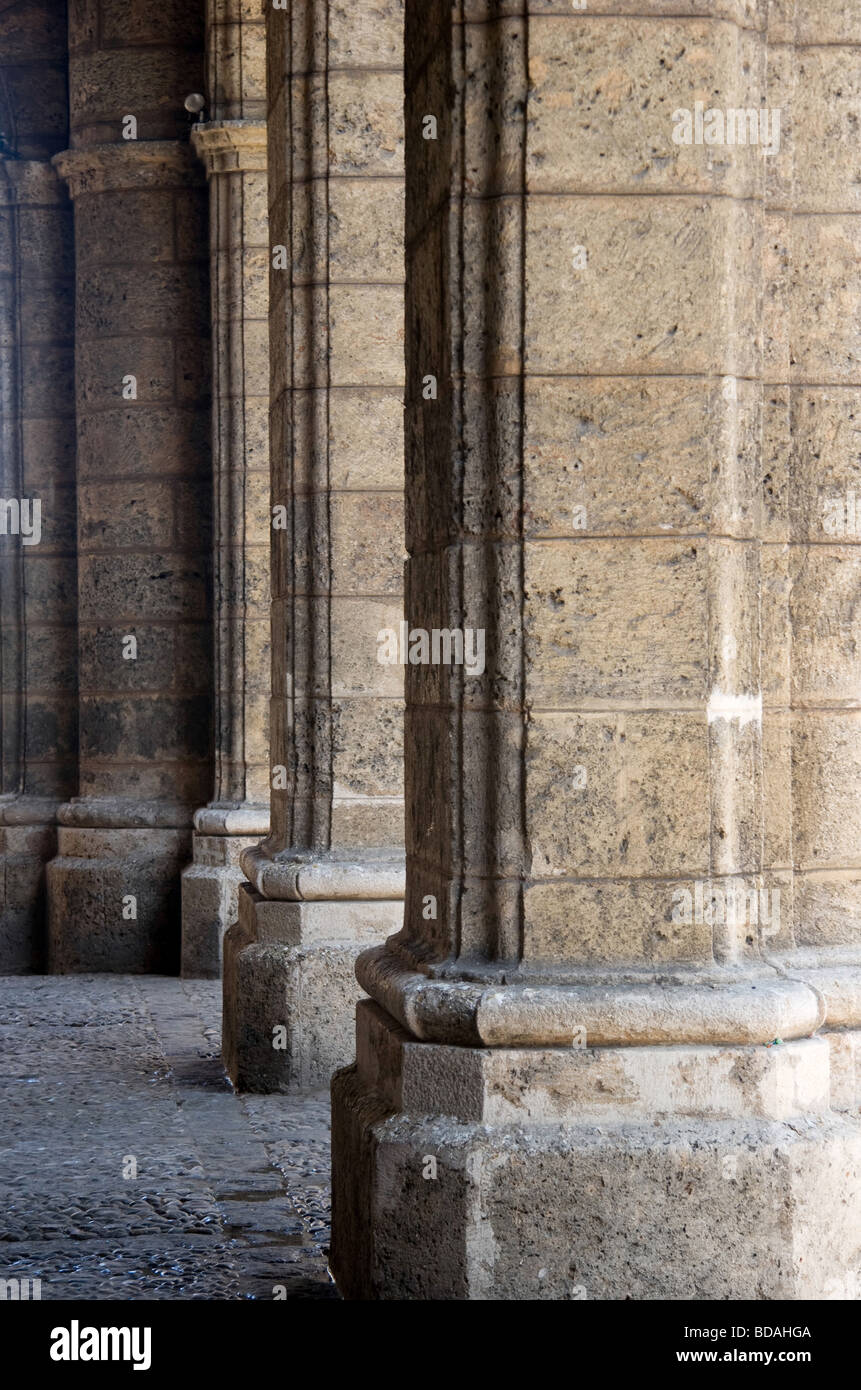 Row of solid travertine columns in Plaza de Armas in Old Havana. Stock Photo