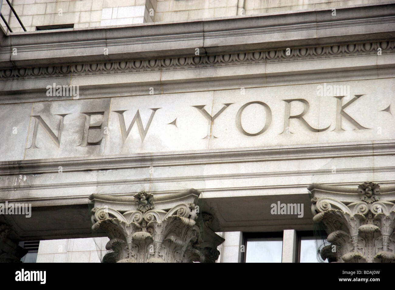 The words New York, engraved in stone in building, lower Manhattan, New