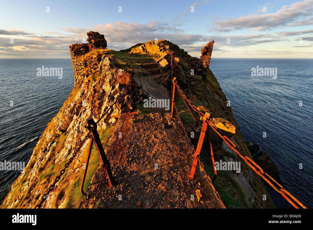 Narrow cliff top bridge leading to Fast Castle in the Scottish Borders Stock Photo